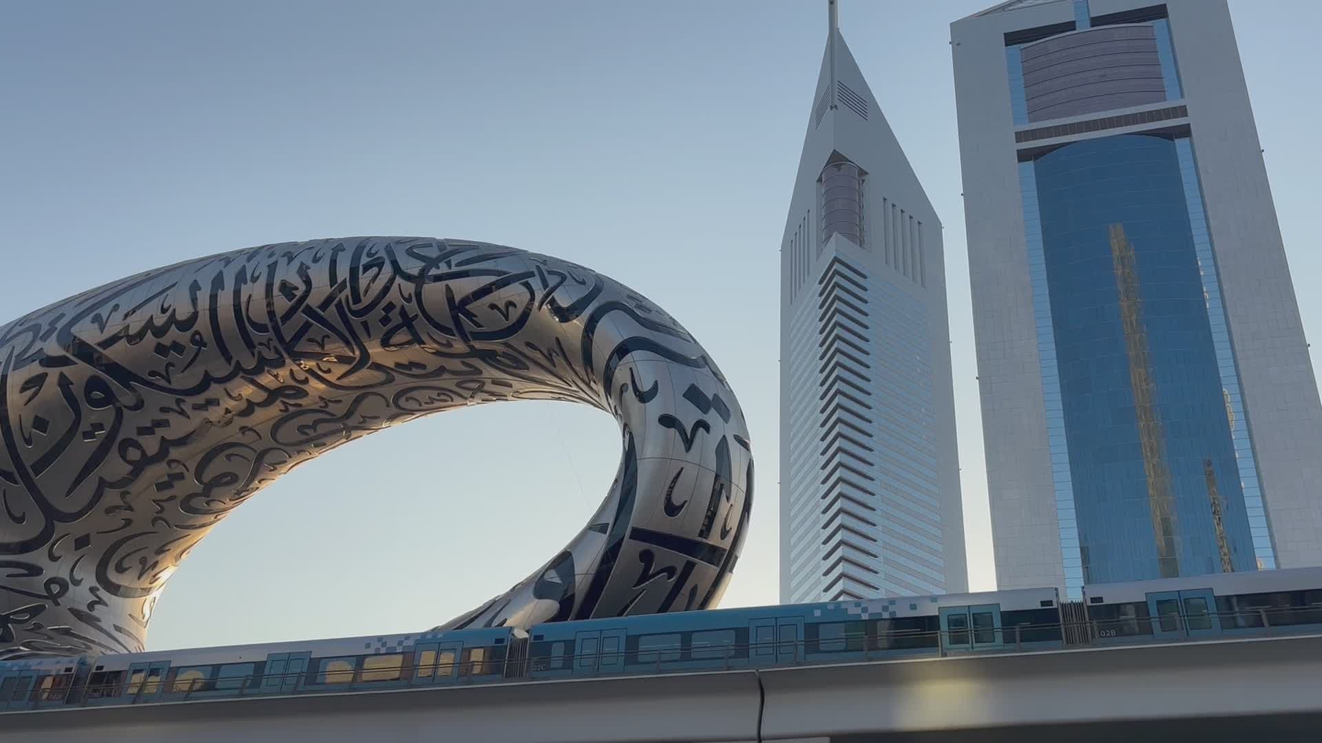 The Dubai skyline glowing at sunset above the Arabian Gulf