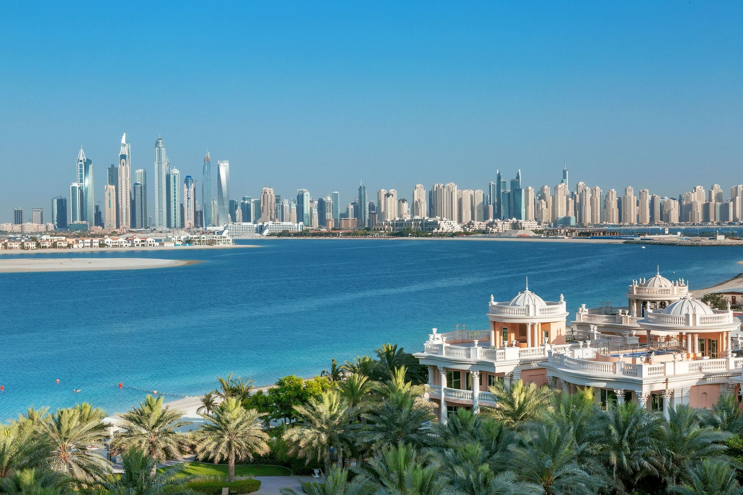 The towers of Dubai Marina across the water from Palm Jumeirah on a clear day